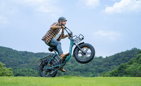 a man riding an engwe l20 boost electric bike on the grass