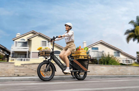 a woman riding an engwe le20 step-thru cargo e-bike on the road