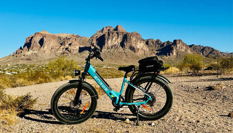 an engwe e26 electric fat bike parked on the sand