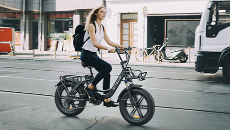 a woman rides a ladies's electric bike, engwe l20, on the road