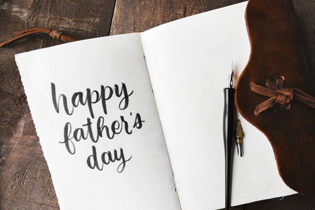 a piece of paper with the words "Happy Father's Day"
