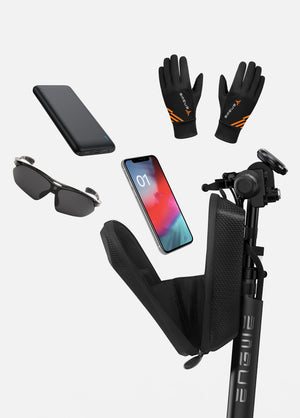 an opened bike bag, mobile phone, sunglasses, power bank and golves